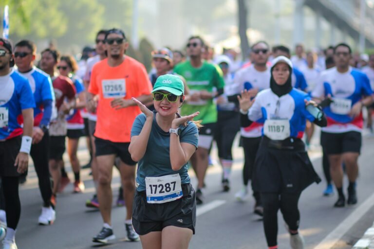 A large group of runners participating in a marathon race event
