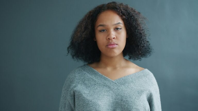A young woman with an annoyed or unimpressed facial expression