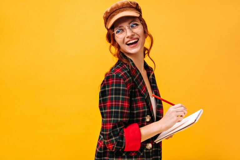 Young professional writing notes and planning a new career path while learning new skills.