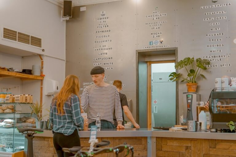 Customer ordering coffee at a café counter