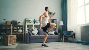 Man doing a quick high-knee exercise burst in his living room