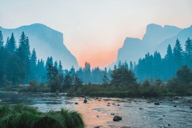 Yosemite Valley landscape with mountains, forest, and a flowing river