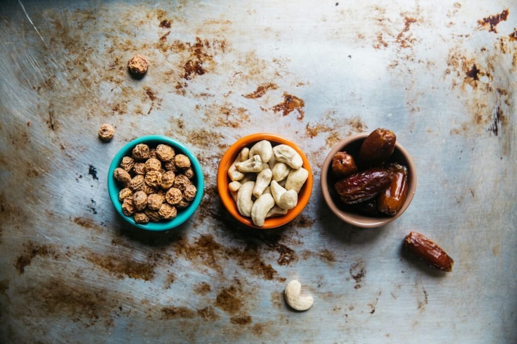Bowls of dried fruit and nuts representing food choices during intermittent fasting