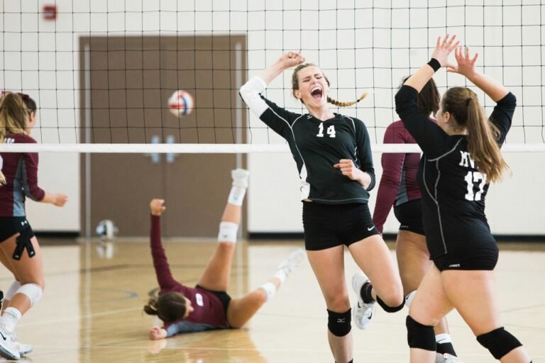 Youth volleyball players competing during a match