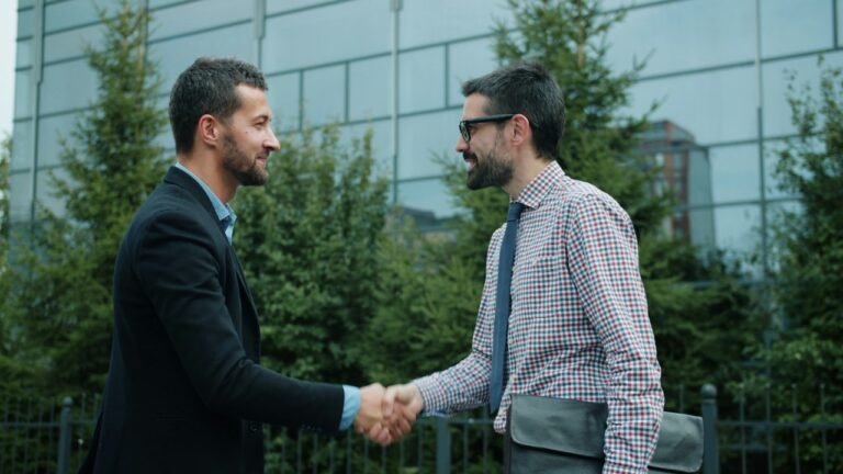 Two professionals shaking hands during a first meeting