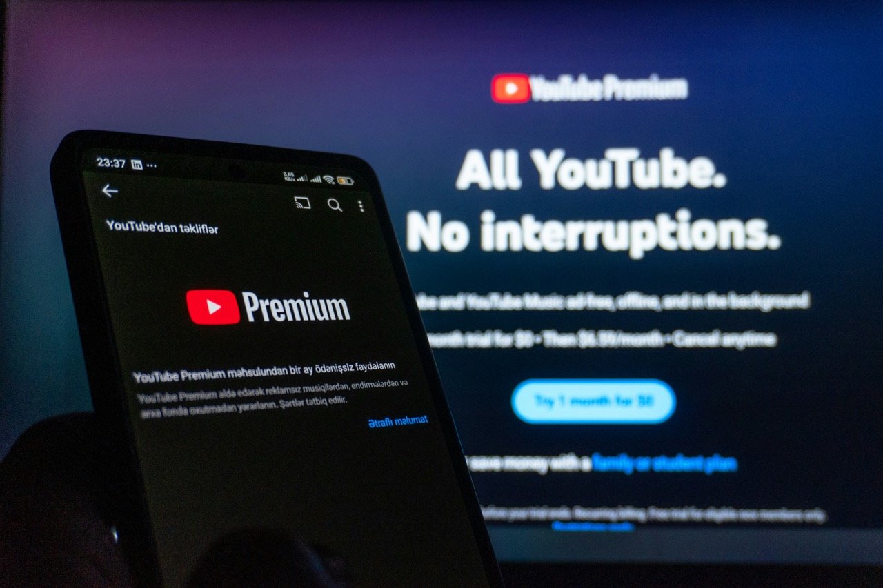 YouTube Premium subscription displayed on a smartphone and computer screen