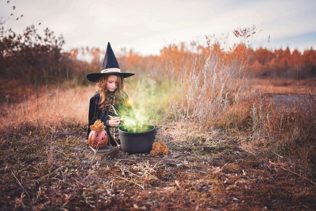 Girl in a witch costume celebrating halloween